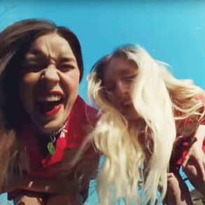 Wet leg video frame - Rhian and Hester looking down into camera lightened