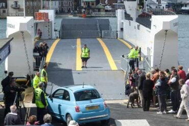 car loading on to the floating bridge on the first day of service