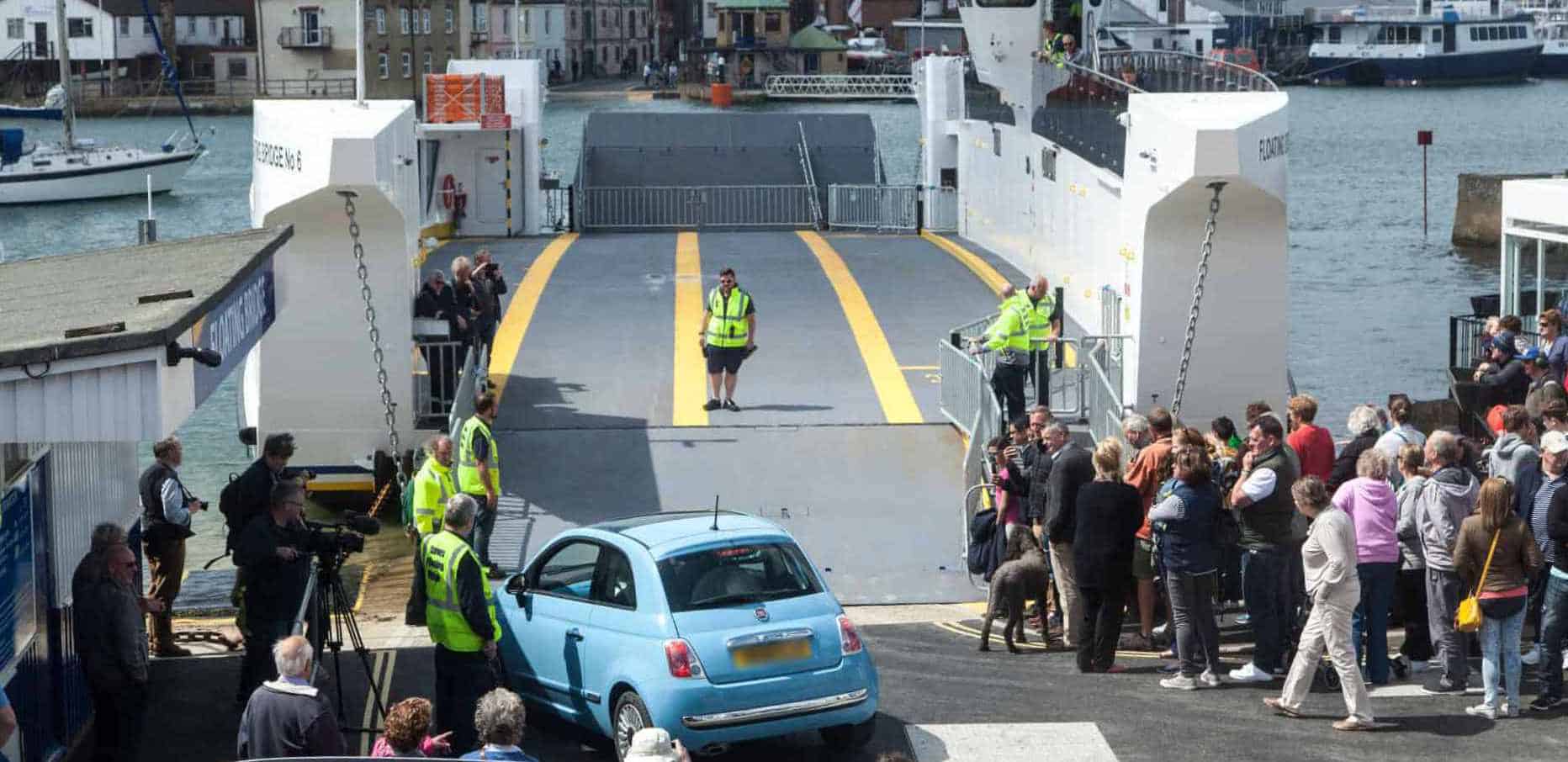 car loading on to the floating bridge on the first day of service