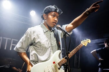 fugo kid performing on stage at strings venue