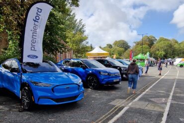 Electric cars lined up in the car park