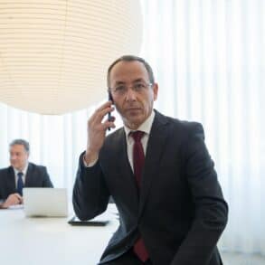 Businessman on Phone in boardroom