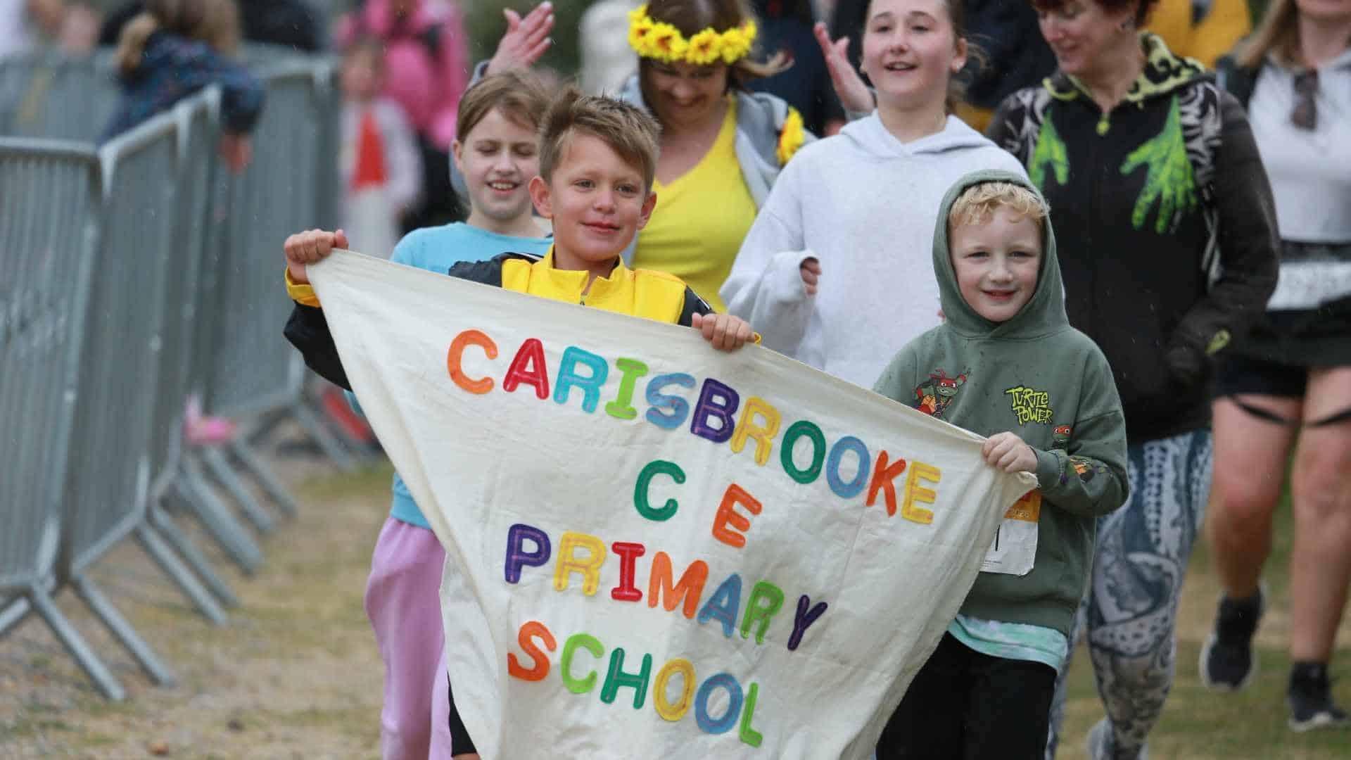 Pupils from Carisbrooke Primary taking prt in walk the wight