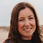 Heidi Perks standing on a beach
