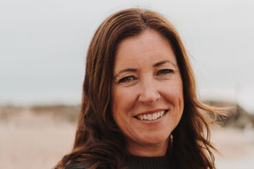 Heidi Perks standing on a beach