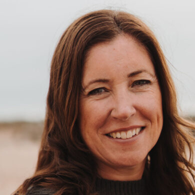 Heidi Perks standing on a beach