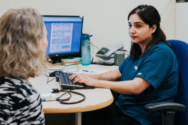 GP giving consultation to patient