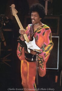 Photo of Jimi Hendrix playing guitar at the 1970 festival 