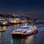 Red Jet coming into harbour at night