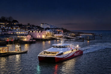 Red Jet coming into harbour at night