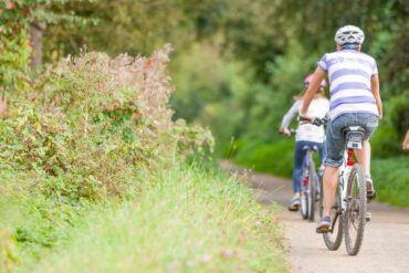 Family cycling on yhe Red Squirrel Trail
