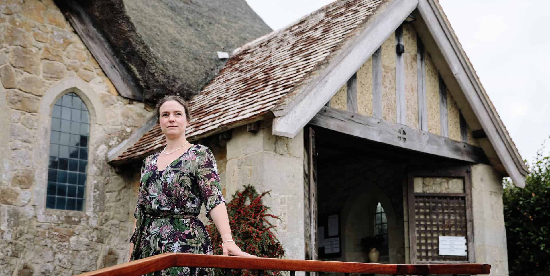 Actress playing Virginia Woolf standing outside St Agnes Church