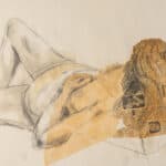Nude life drawing of woman laying on bed
