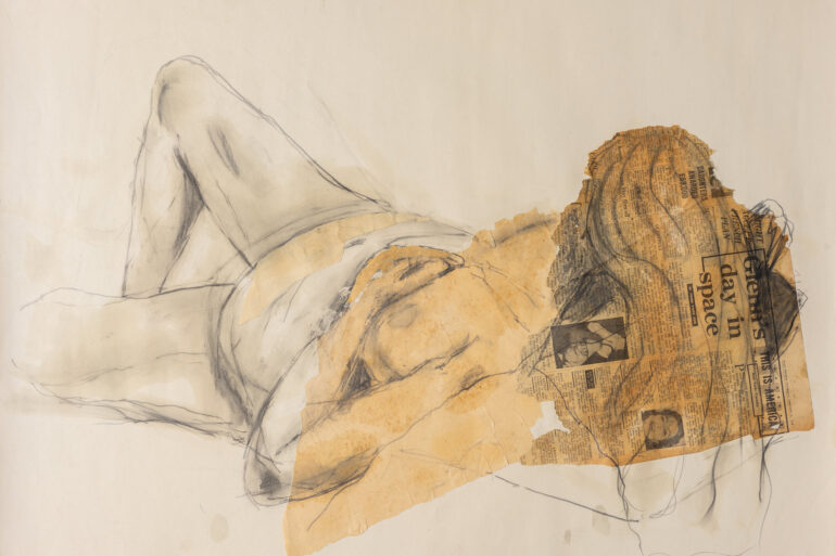 Nude life drawing of woman laying on bed