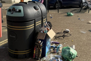 rubbish left by bin on sandown seafront