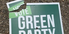 vandalised green party sign