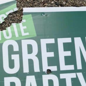 vandalised green party sign