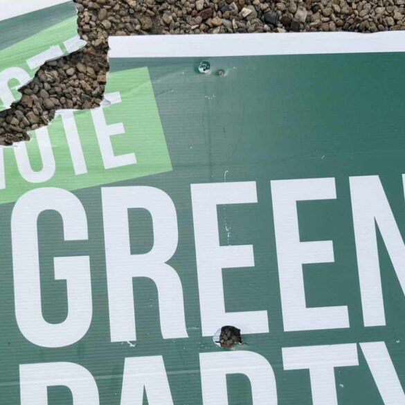 vandalised green party sign