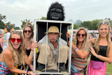 Festival Goers with man dressed in gorilla outfit