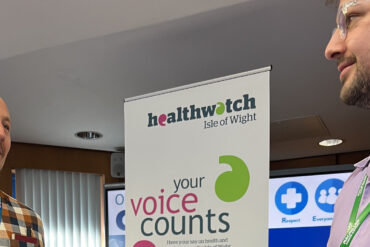 Healthwatch officer (Engagement) Nathan Holt talking to Cancer Pathway Care Navigator at St Mary's