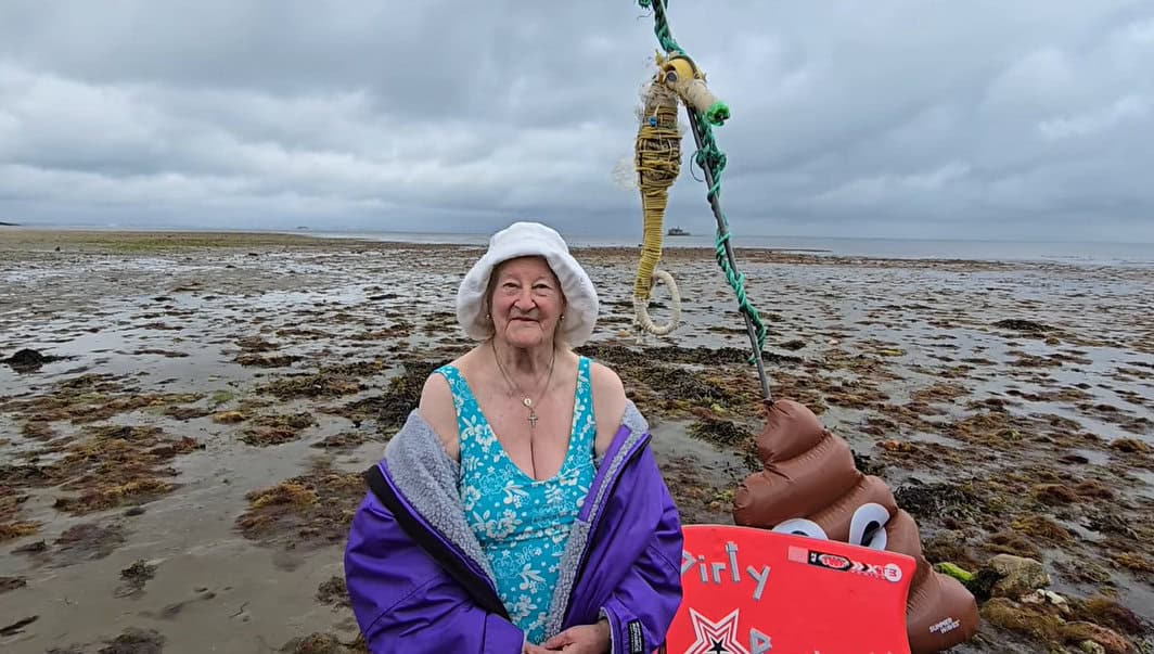 Lady Sally Grylls in swimsuit on rainy day for protest