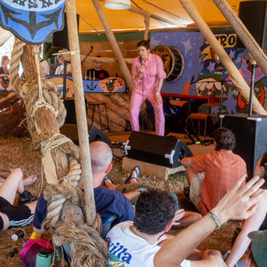 Lily Blacksell performing on stage at Glastonbury