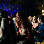 People dancing in the woodland