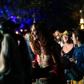 People dancing in the woodland