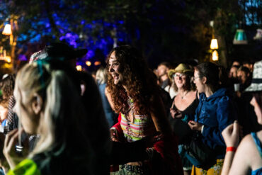 People dancing in the woodland