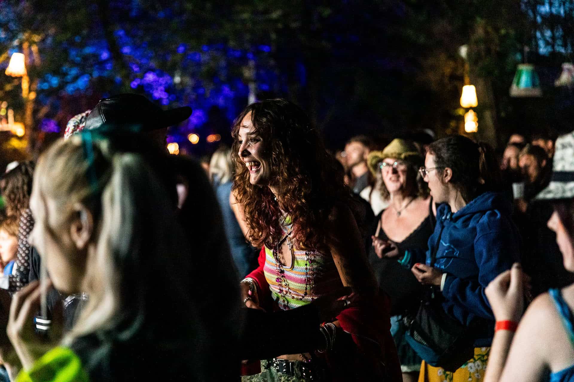 People dancing in the woodland