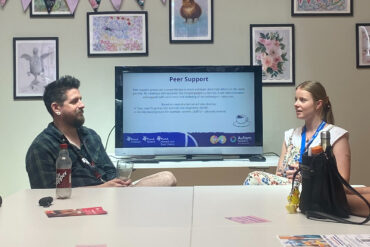 People chatting at the Autism/ADHD Hub