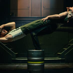 Two acrobats performing on stage