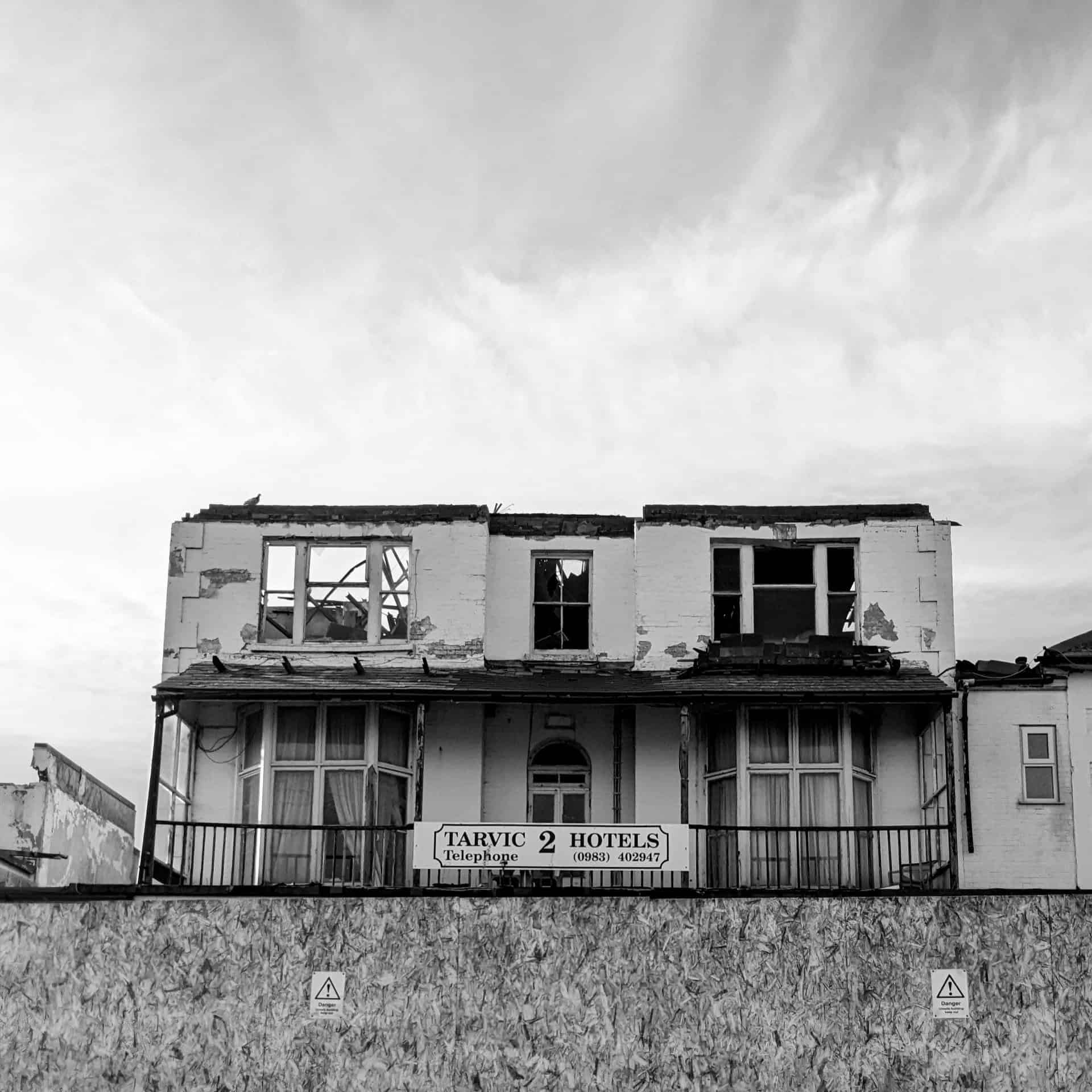 Black and white image of a burnt down sandown hotel