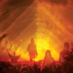 Silhouette shot of people in front of the Glastonbury pyramid stage