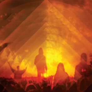 Silhouette shot of people in front of the Glastonbury pyramid stage