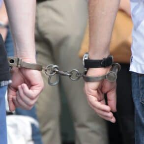 two people handcuffed together