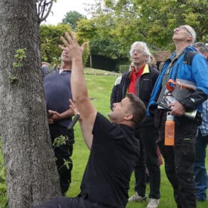 Ben showing new wardens how to checking tree health