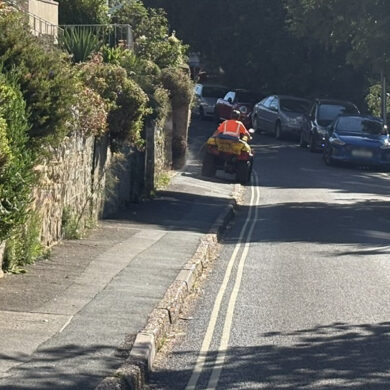 Island Roads contractor on a quad bike spraying glyphosate - Madeira Road, Ventnor