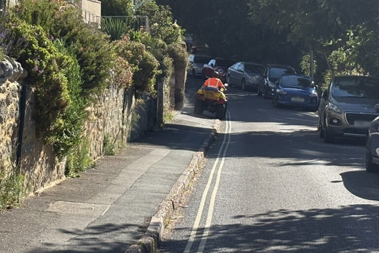 Island Roads contractor on a quad bike spraying glyphosate - Madeira Road, Ventnor