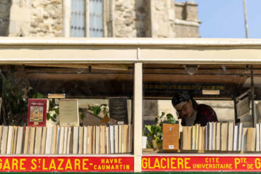 Woman looking at books on the Book Bus