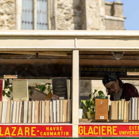 Woman looking at books on the Book Bus
