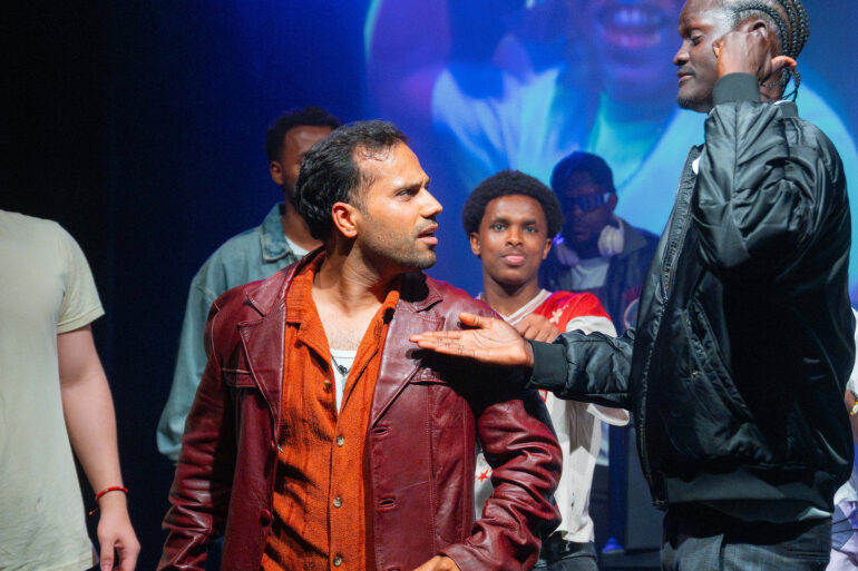 Refugee-led theatre company perform on stage