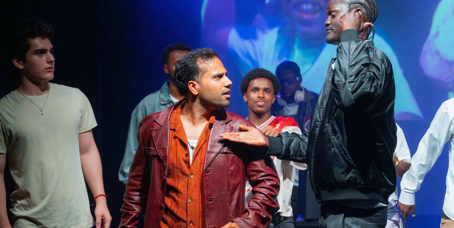 Refugee-led theatre company perform on stage