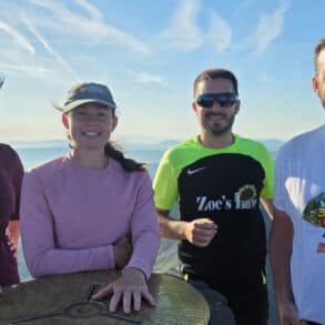 Lawrence and the team at the top of a mountain