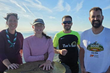Lawrence and the team at the top of a mountain