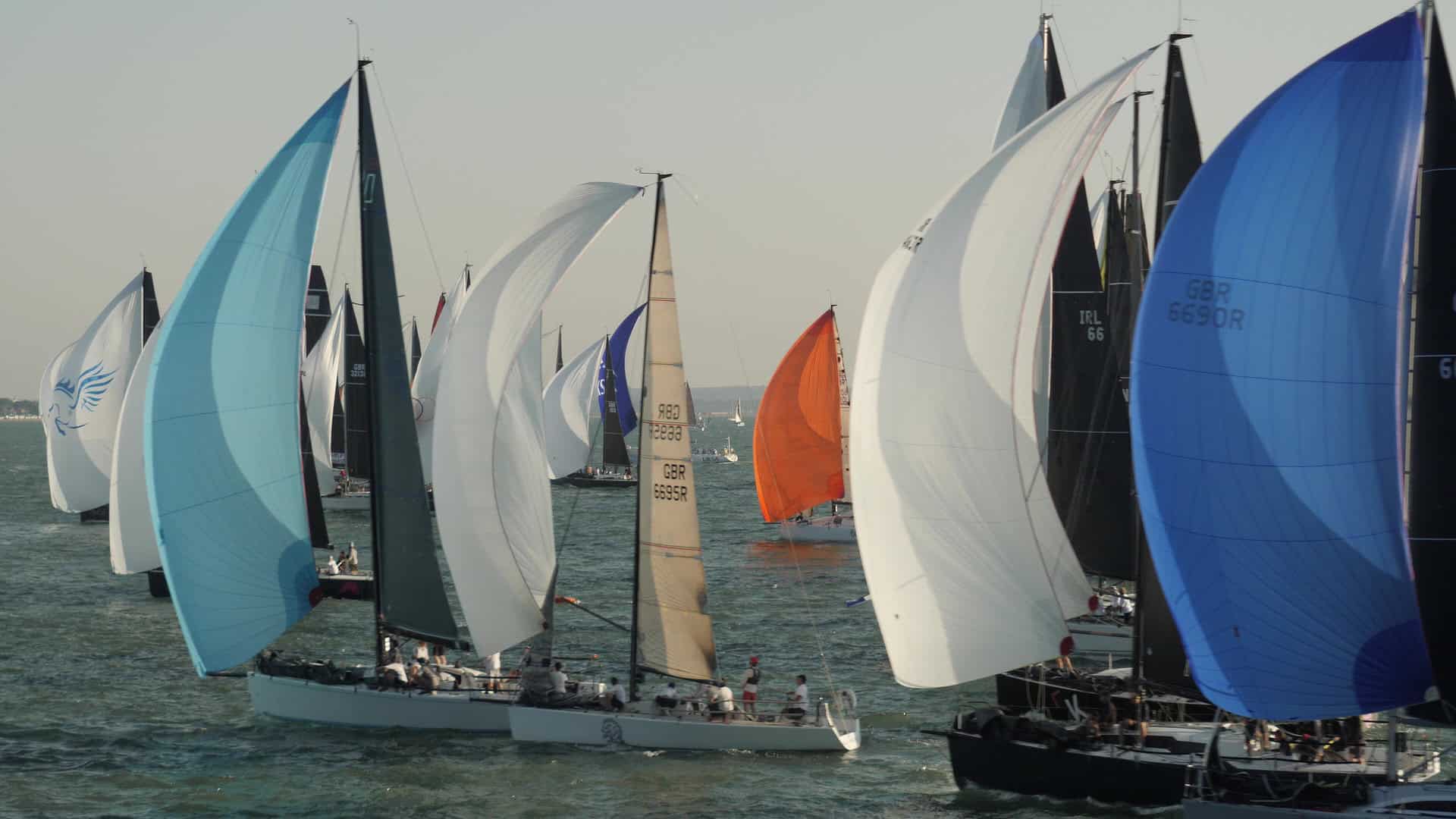 Boats with their colourful spinnakers up for Round the Island Race 2026