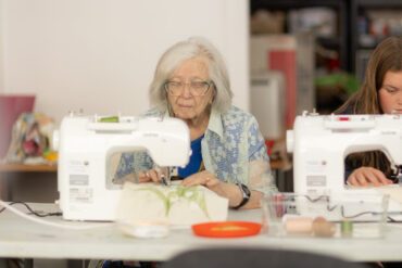 People sewing at Independent Arts by Julian Winslow