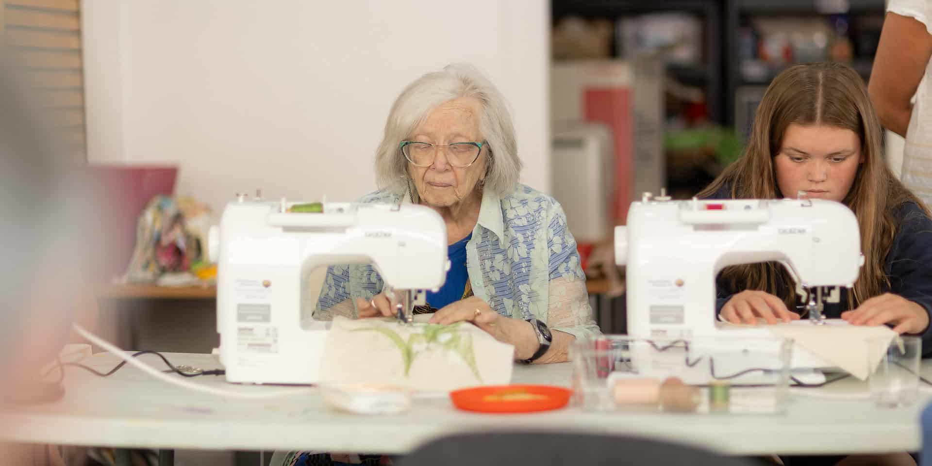 People sewing at Independent Arts by Julian Winslow