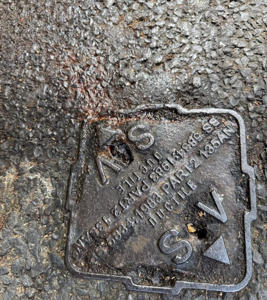 Rusty water coming from filled borehole 