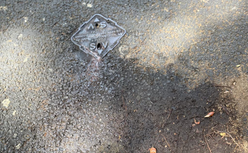 Rusty water coming from filled borehole 